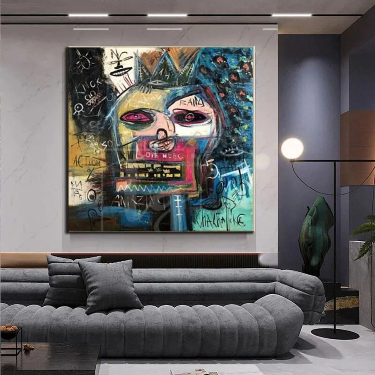 Room mockup showing crowned abstract face in blue, pink, yellow and black surrounded by scribbles and symbols.
