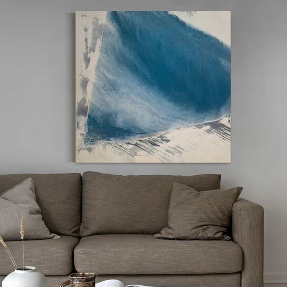 Room mockup showing broad layered blue brushstroke with pale feathered edges against an off-white square background.
