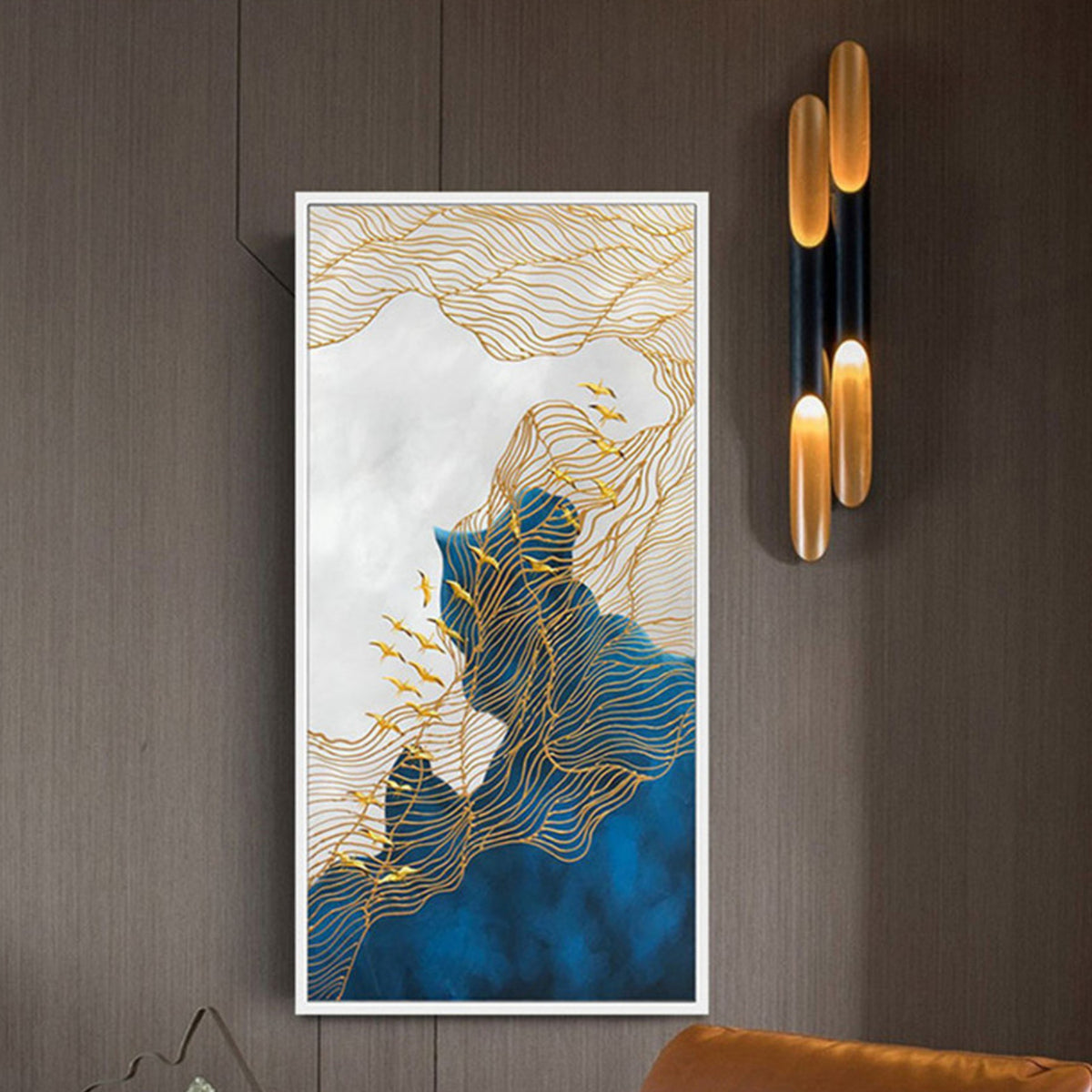 Room mockup. Fine gold-coloured contour-like lines flow over deep blue and pale white abstract fields, with small leaf-like accents.