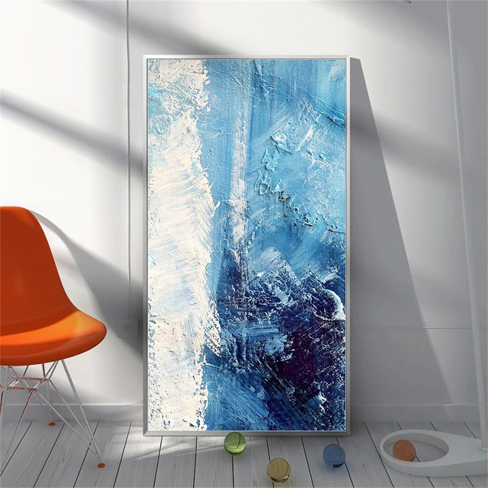 Room mockup showing blue and white textured abstract painting with a dense navy patch and flowing pale marks.