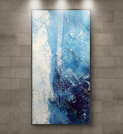 Room mockup showing blue and white textured abstract painting with a dense navy patch and flowing pale marks.