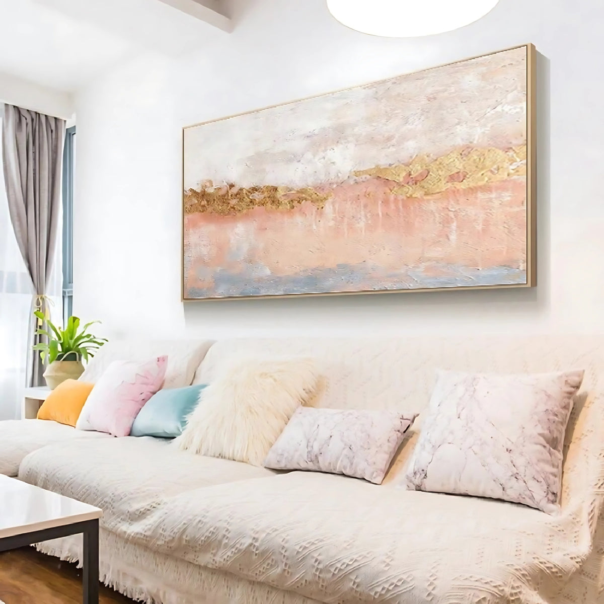 Room mockup showing soft white and blush pink textured bands divided by an irregular gold-coloured horizontal strip.