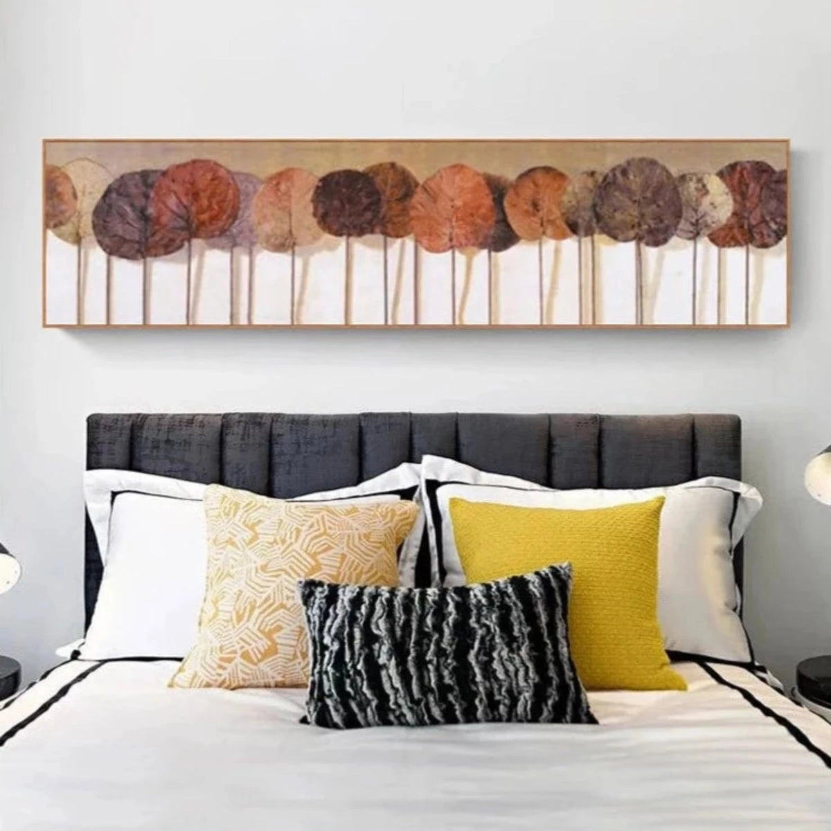Room mockup showing row of round stylised trees in brown, rust, orange and muted mauve on thin pale trunks against cream.