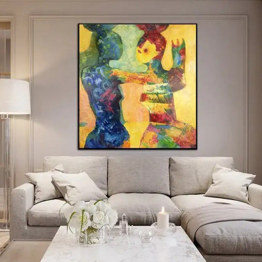 Room mockup. Two stylised embracing figures formed from blue, green, orange and red shapes on a bright yellow background.