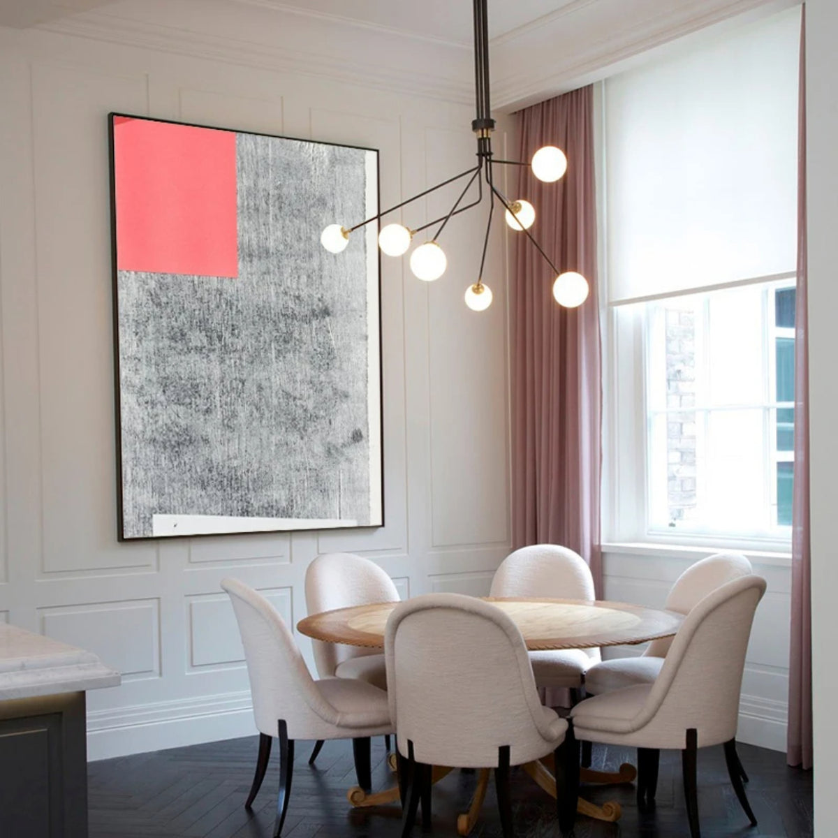 Room mockup. A coral-red rectangle occupies the upper left of a pale grey field covered with dark fine textured marks.