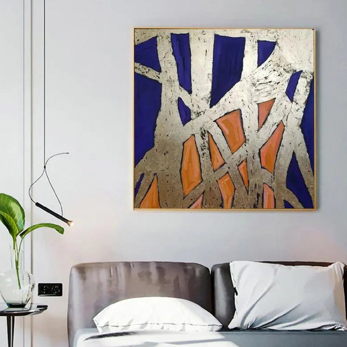 Room mockup. Rough pale cream intersecting strips form an angular web over deep blue and orange geometric patches.