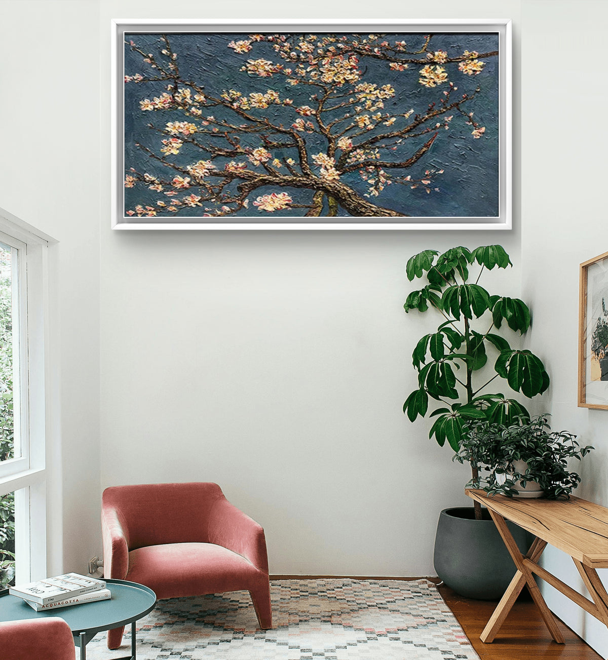 Room mockup showing spreading dark branches with small cream and pale pink blossoms against a textured slate blue background.