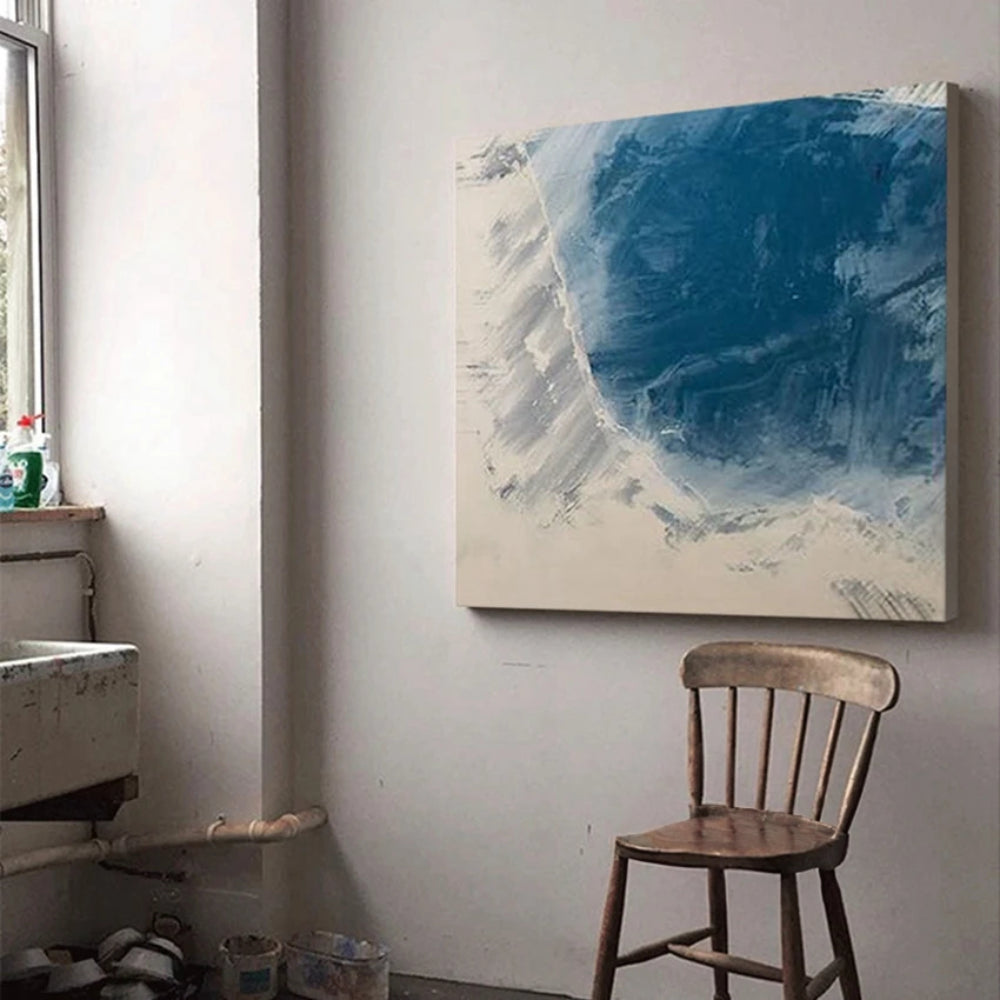 Room mockup showing rounded deep blue brushstroke with rough pale edges against an off-white square background.