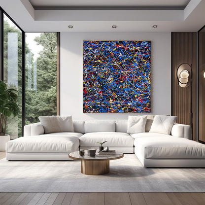 Modern living room with a white sofa, abstract painting, and coffee table.