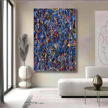Abstract painting in a modern living room with a sofa and decorative items.