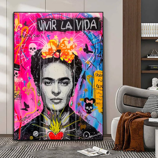 Room mockup showing black-and-white Frida Kahlo portrait with orange flowers, a red heart and pink-blue graffiti reading Vivir la Vida.