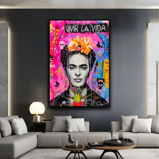 Room mockup showing black-and-white Frida Kahlo portrait with orange flowers, a red heart and pink-blue graffiti reading Vivir la Vida.