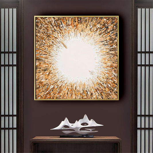 Room mockup showing gold-coloured and white abstract painting with dense textured marks radiating around a bright white centre.