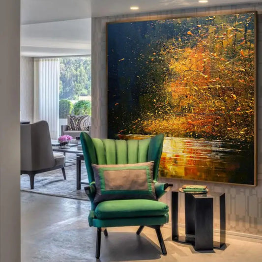 Room mockup showing glowing gold and orange foliage-like marks reflected across water against a deep blue background.