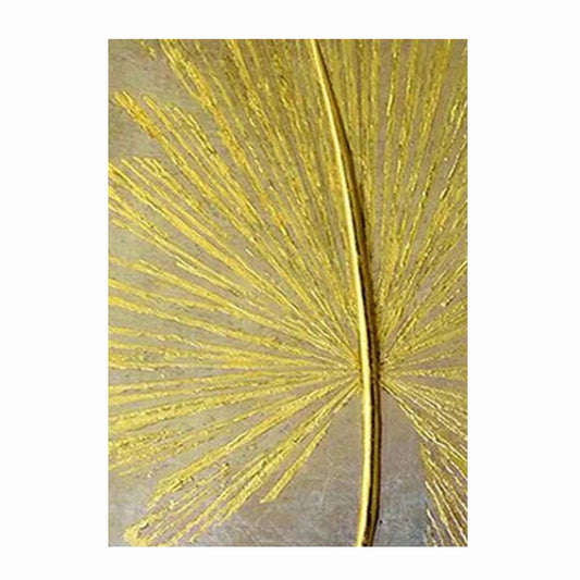 Gold palm leaf design on a textured surface