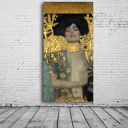 Gold-patterned woman portrait displayed against a white brick wall above a grey plank floor.