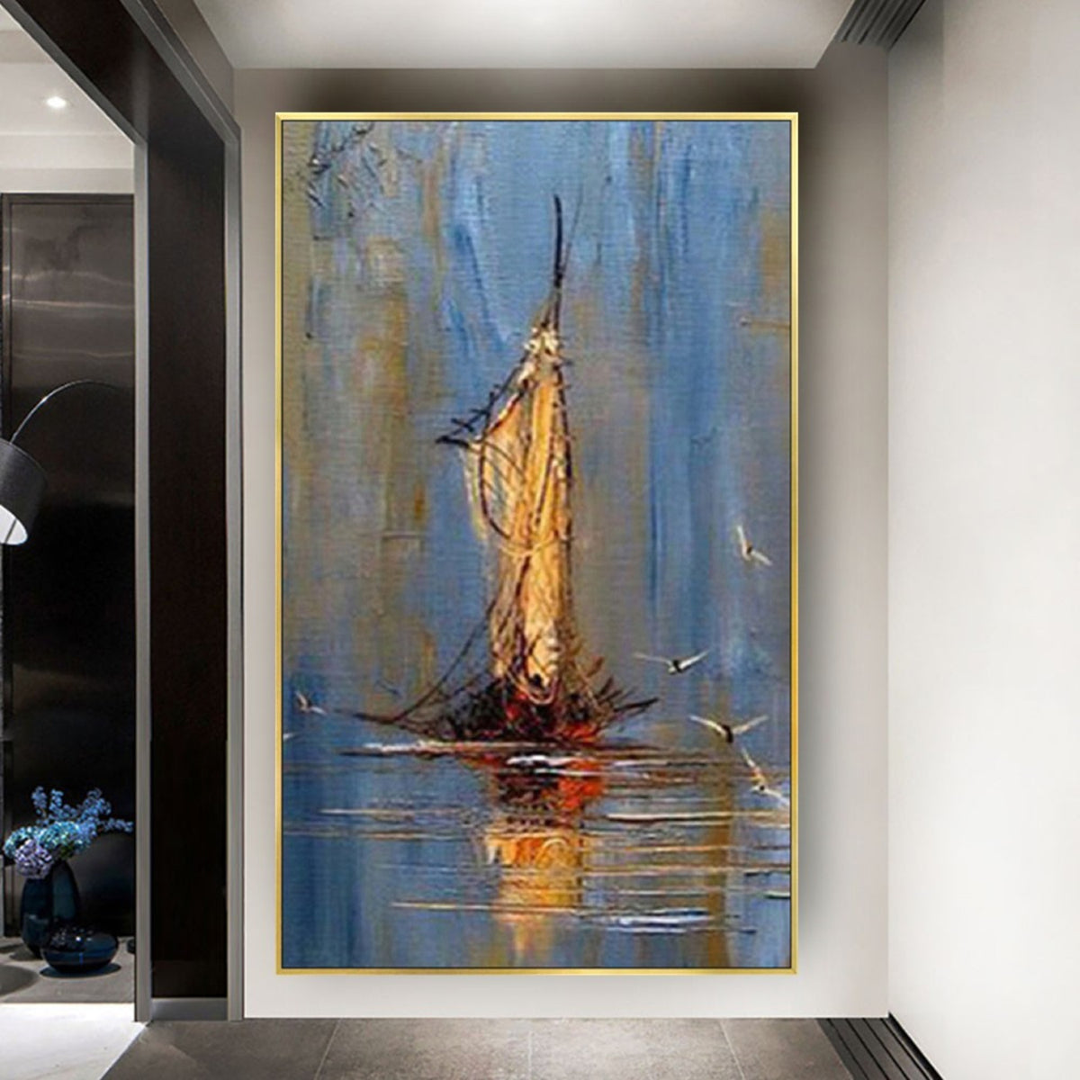 Room mockup. A slender boat with a tall gold-coloured sail and fine rigging reflected on calm blue water.
