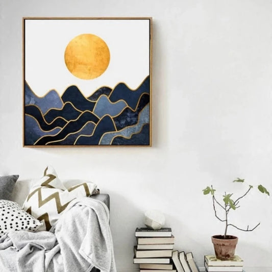 Room mockup showing round gold-coloured sun above layered navy and blue-grey waves outlined in gold-coloured lines against cream.