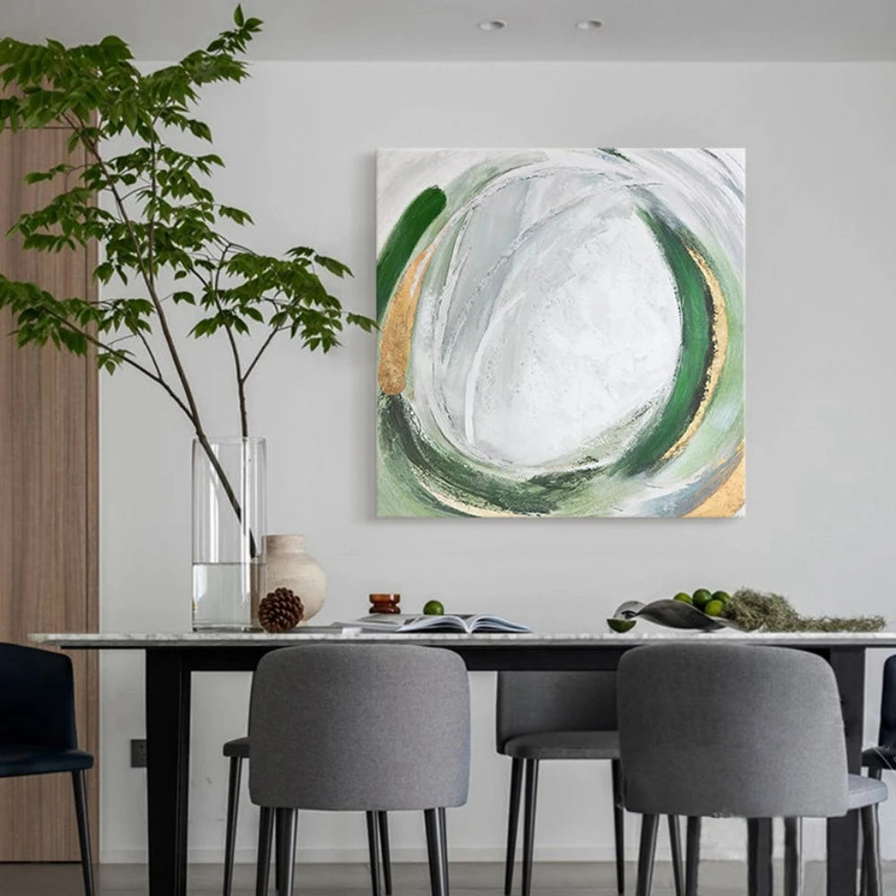 Room mockup showing looping green and grey oval brushstrokes with gold-coloured accents around a white textured centre.