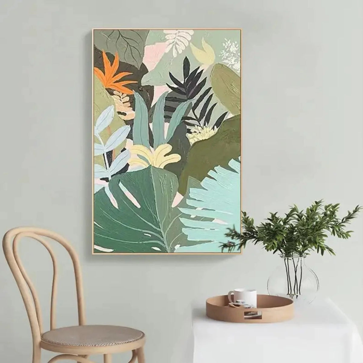 Room mockup showing layered tropical leaves in sage, mint, olive and dark green with a bright orange flower and pale pink shapes.