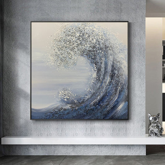 Room mockup. A tall curling blue-grey wave with pale foamy texture rises against a quiet cream and grey background.