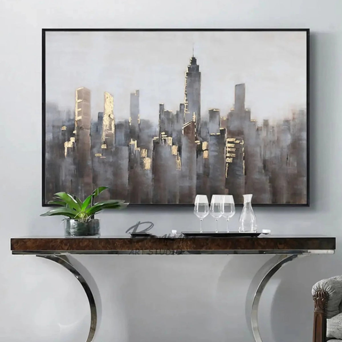 Room mockup showing dense grey and muted brown city towers with small gold-coloured highlights beneath a broad pale grey sky.