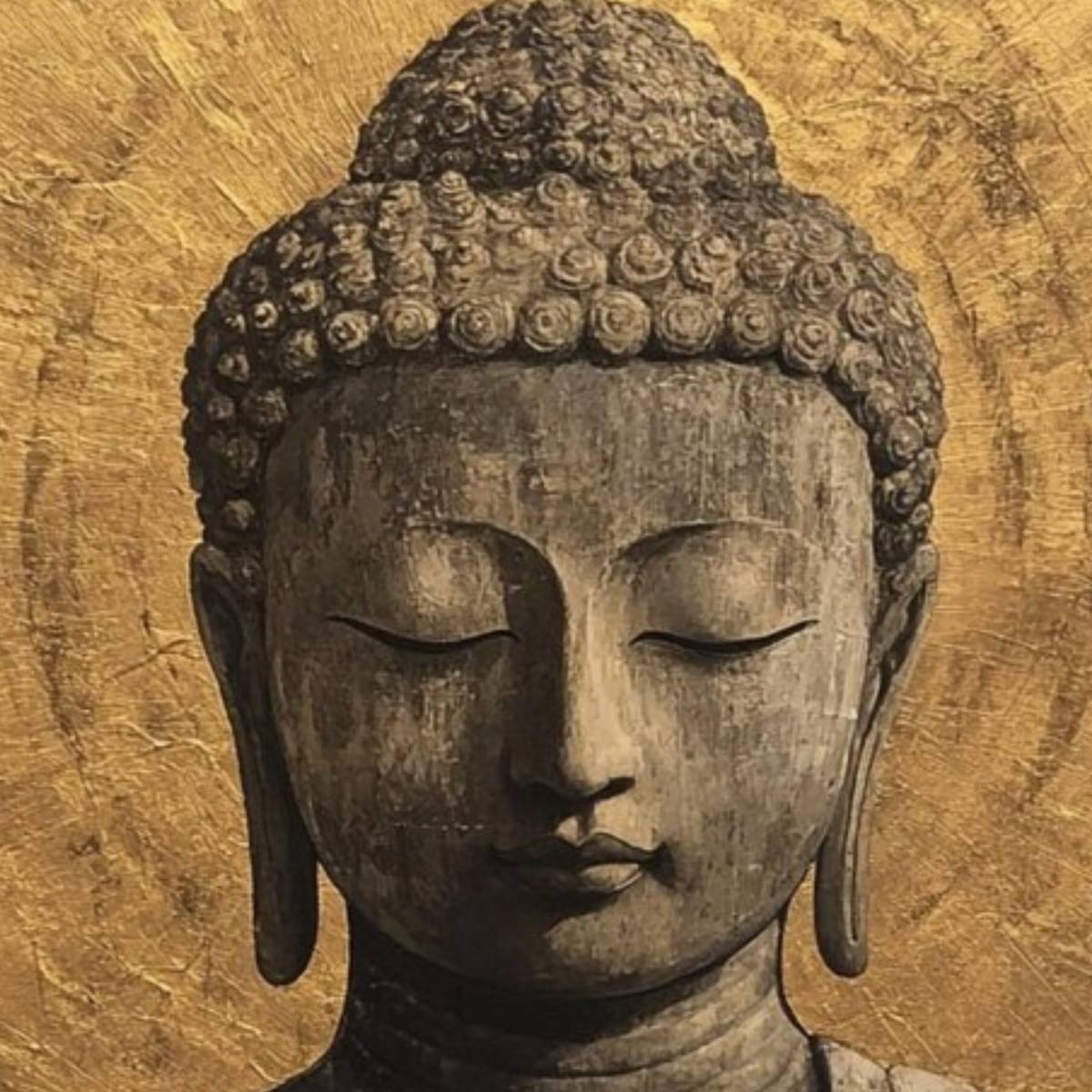 Close-up of the Buddha’s head and curled hair against the gold halo.