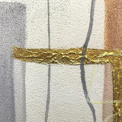 Close-up of a raised gold-coloured strip crossing pale grey textured fields and thin dark curved lines.