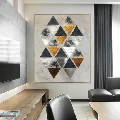 Room mockup. A staggered cluster of black, grey, white and ochre triangles on a pale cream textured ground.