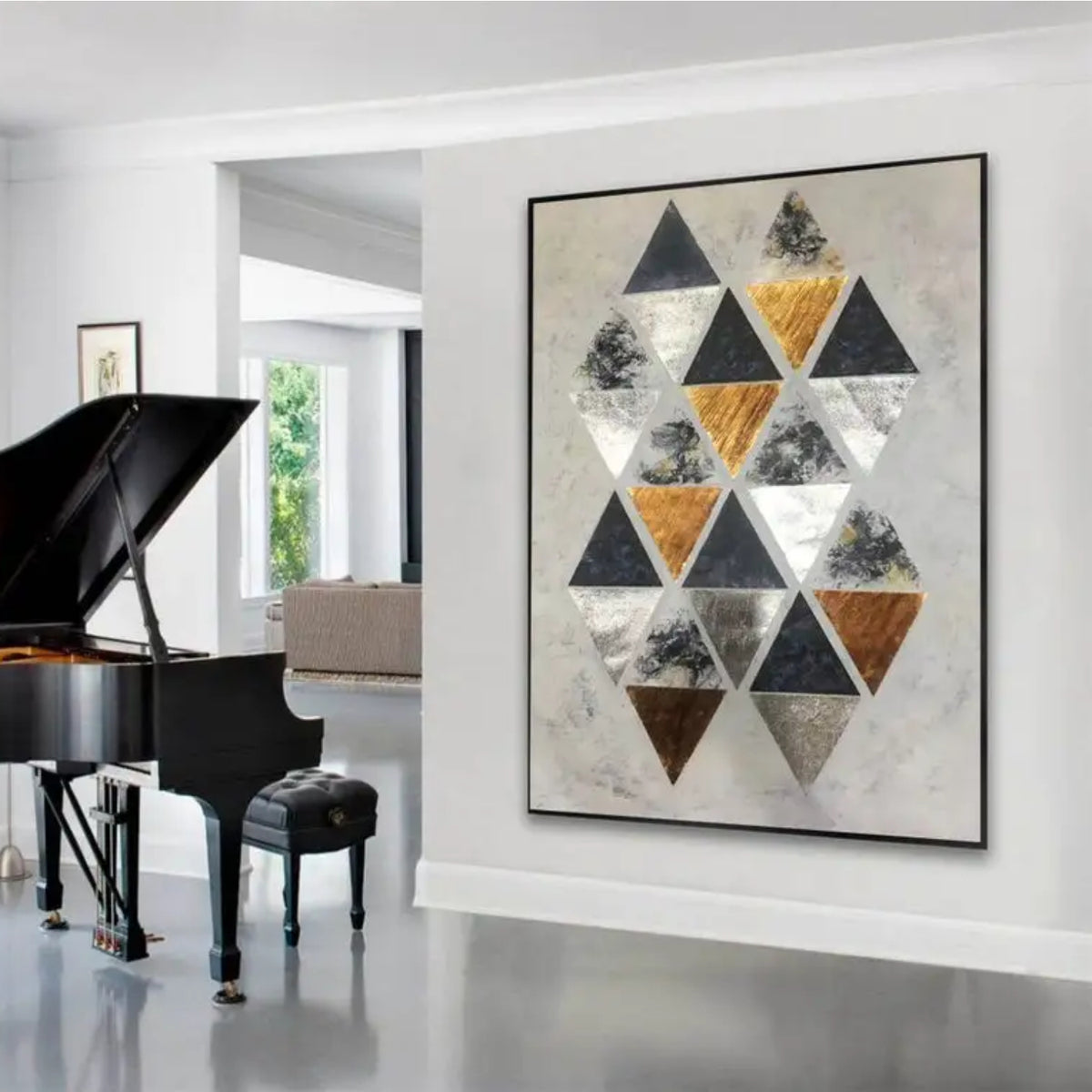 Room mockup. A staggered cluster of black, grey, white and ochre triangles on a pale cream textured ground.