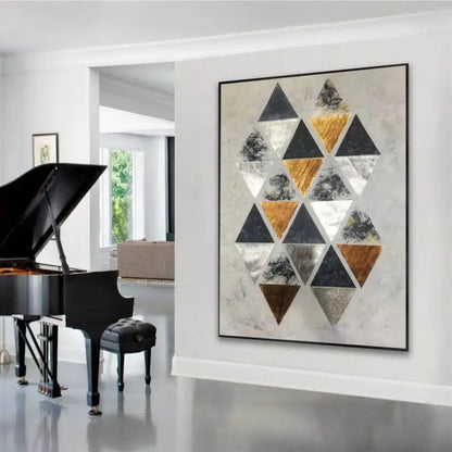 Room mockup. A staggered cluster of black, grey, white and ochre triangles on a pale cream textured ground.