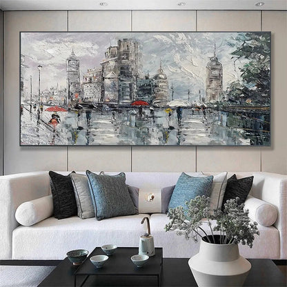 Room mockup showing rainy grey city street with tall buildings, small figures carrying umbrellas, red accents and wet reflections.