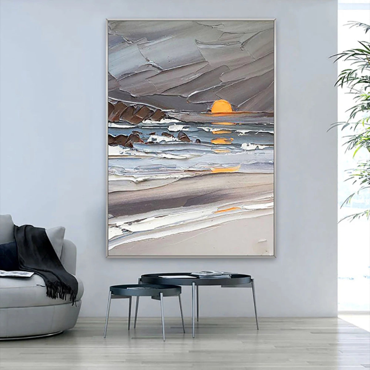 Room mockup showing yellow setting sun above a grey-blue sea with white waves and a dark rocky shore.