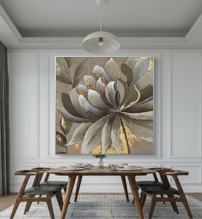 Room mockup. A large layered grey and white flower with brown leaves and gold-coloured patches on a muted taupe background.