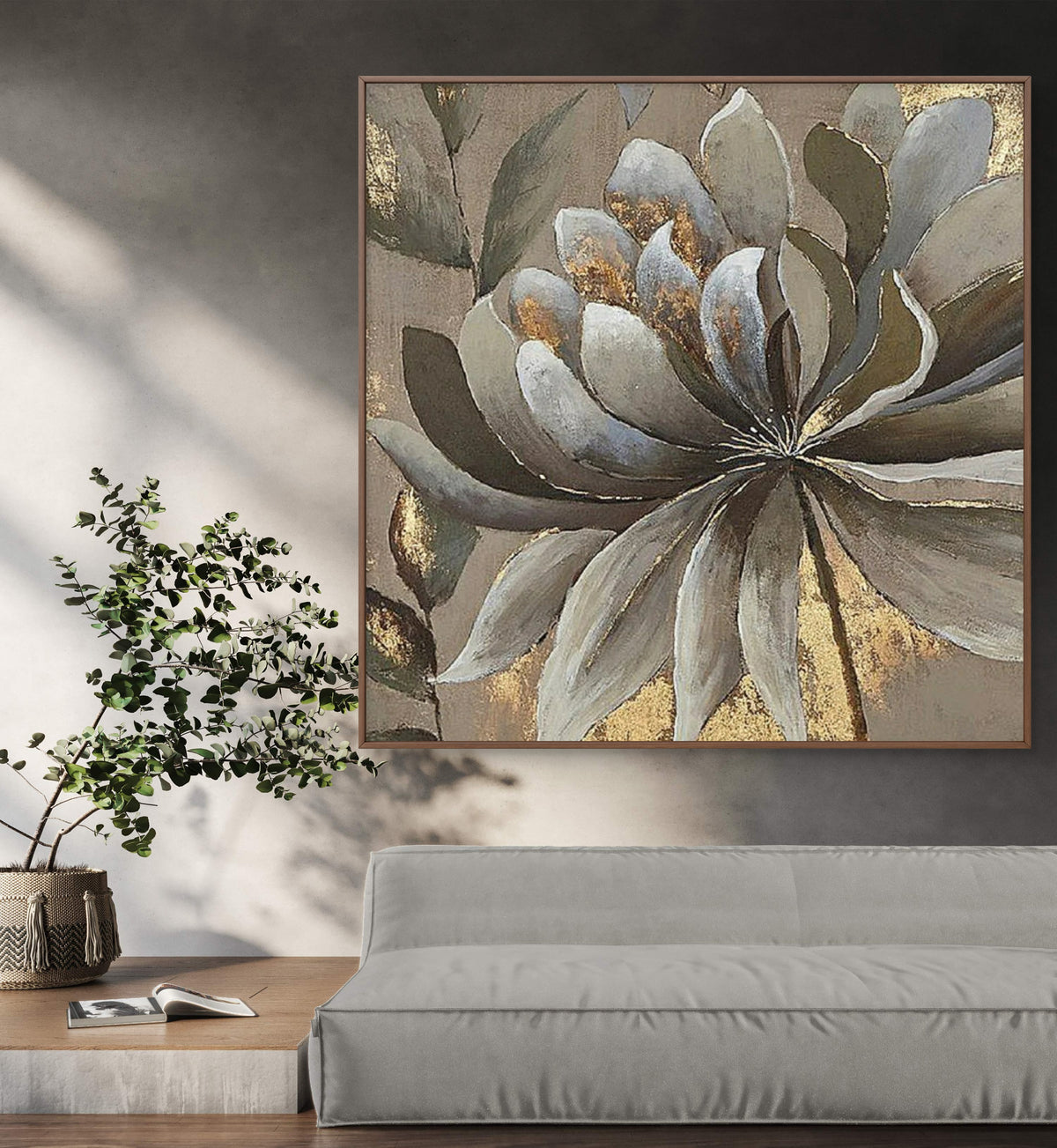 Room mockup. A large layered grey and white flower with brown leaves and gold-coloured patches on a muted taupe background.