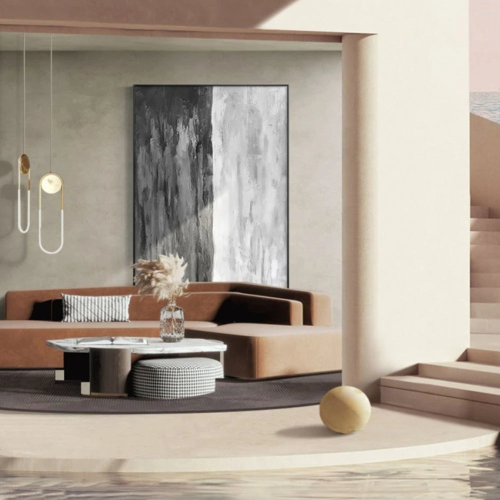 Room mockup showing monochrome abstract with irregular vertical charcoal, grey and white streaks across a tall textured surface.