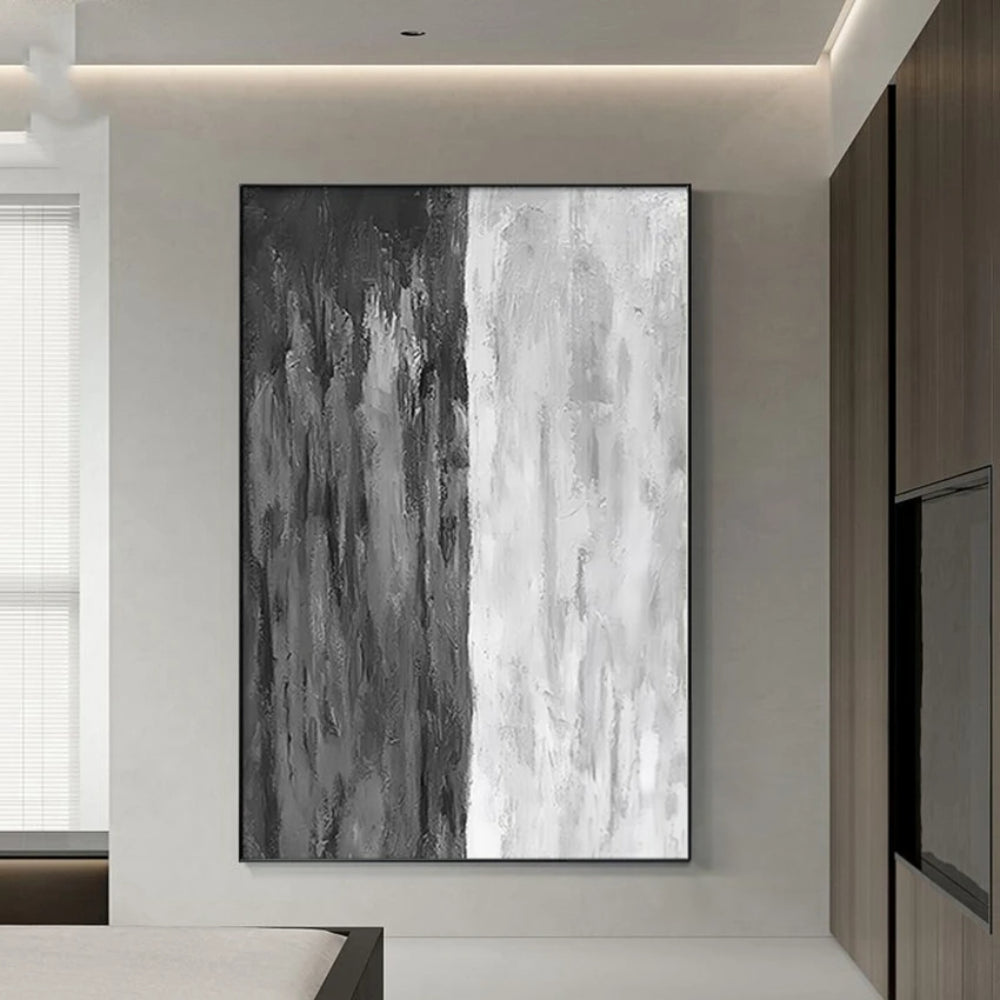 Room mockup showing monochrome abstract with irregular vertical charcoal, grey and white streaks across a tall textured surface.
