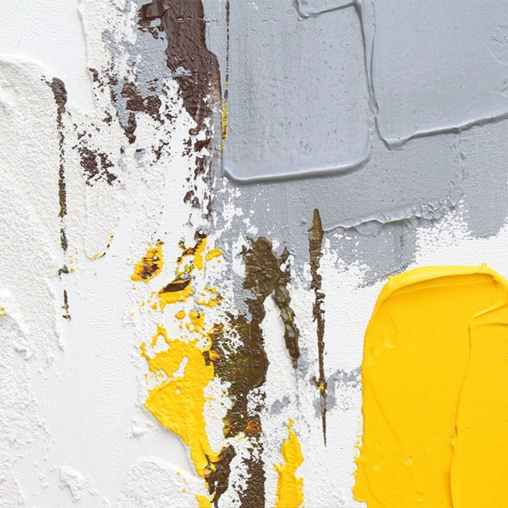 Close-up of textured white abstract with a grey upper block, mustard yellow lower block and narrow dark brown marks.