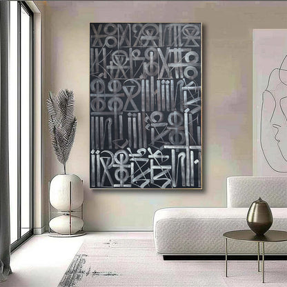 Hand-painted abstract calligraphic symbol artwork in white and grey on a black background.