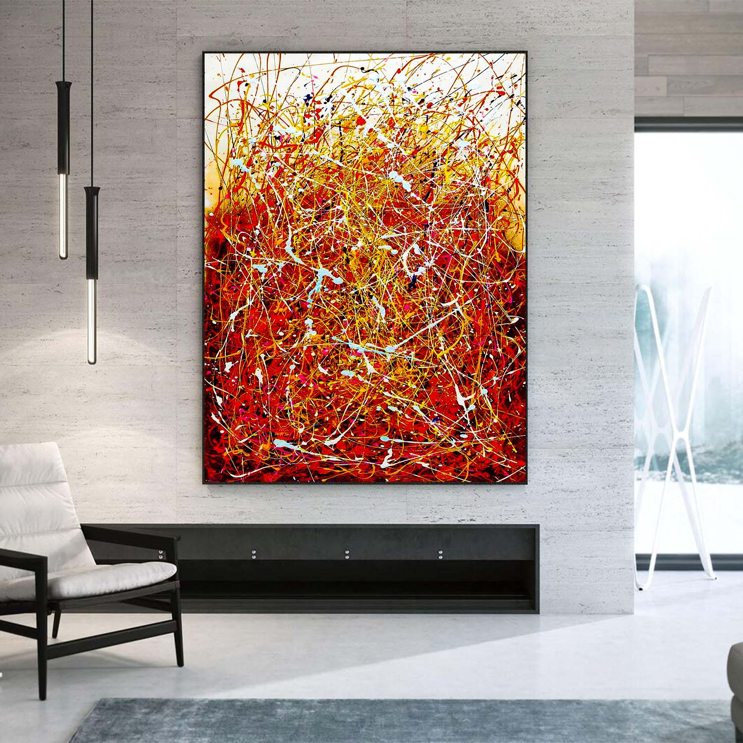 Abstract painting with red and yellow colors on a wall in a modern living room.