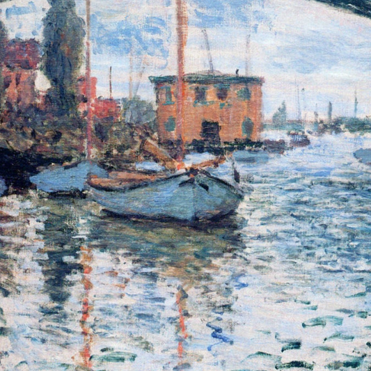 Detail of moored sailboats beside warm-toned riverside buildings.