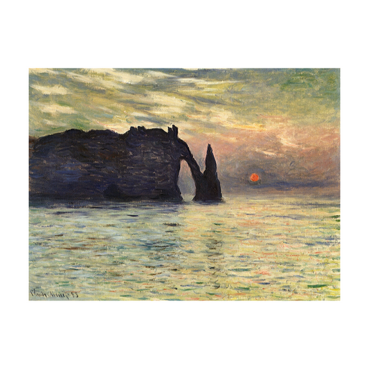 Dark Étretat rock arch beside an orange sunset over reflective sea.