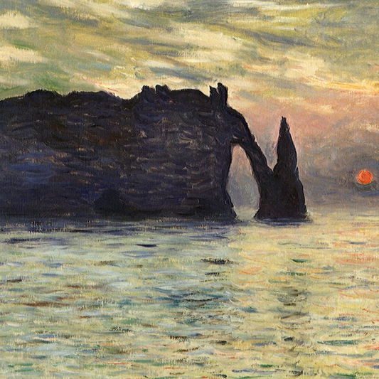 Close-up of the dark coastal arch and warm sunset sky.