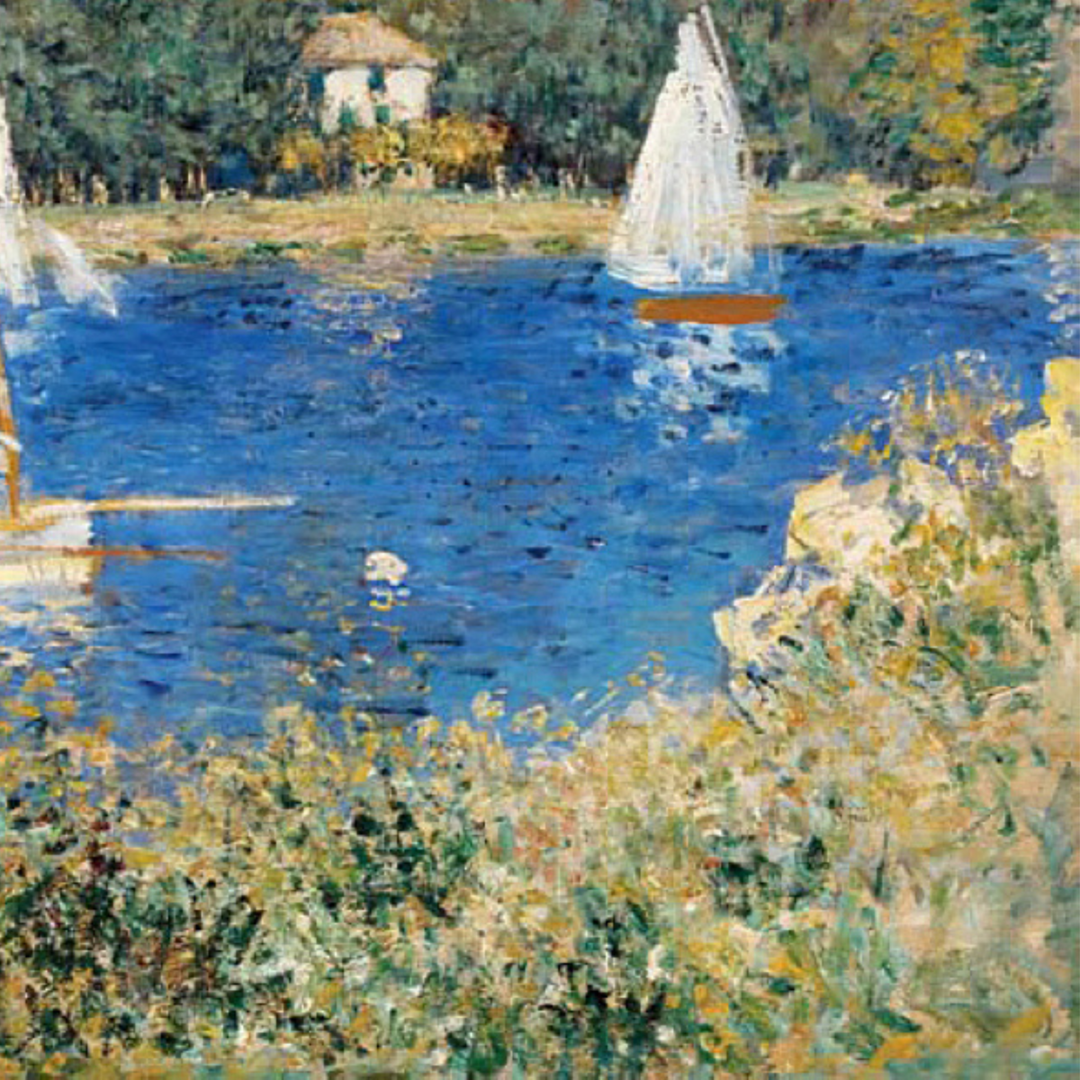 Close-up of a white sailboat and blue water beside grassy foliage.