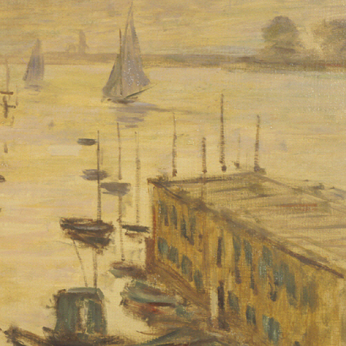 Detail of a sailboat and ochre waterfront buildings.