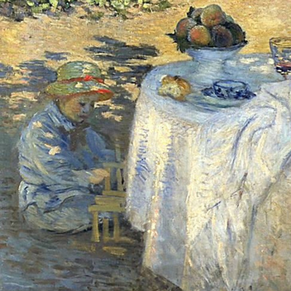 Detail of a child beside the garden table and white tablecloth.
