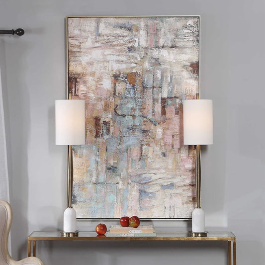 Room mockup showing layered muted pink, pale blue, grey and brown geometric marks across a finely textured abstract surface.