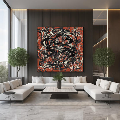 A large square abstract wall art piece with black scribbled lines over a rust red and off-white background, displayed above a white sectional sofa in a modern living room.
