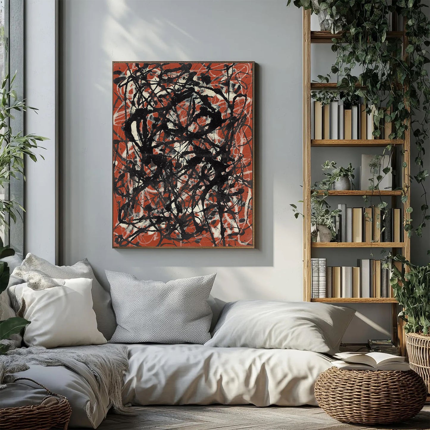 An abstract canvas painting with black scribbled lines over a terracotta orange and cream background, hanging on a light gray wall above a modern white sofa in a styled living room.