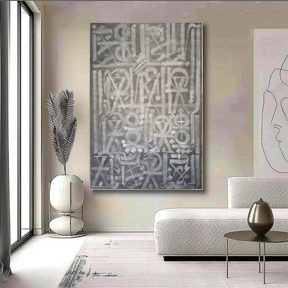 Hand-painted canvas showing symbols, calligraphic marks and geometric forms in neutral tones.